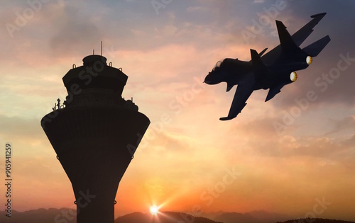 fighter jet flyby near airbase communication tower at sunrise