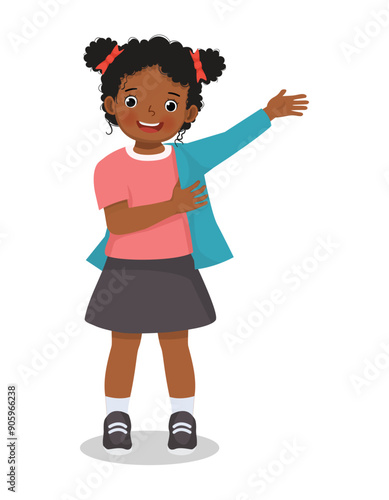 Cute little African girl wearing clothes dressing up daily routine activity
