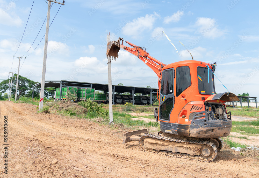 Small excavator move ple to hole for make fence. Small excavator move ple to hole for make fence.