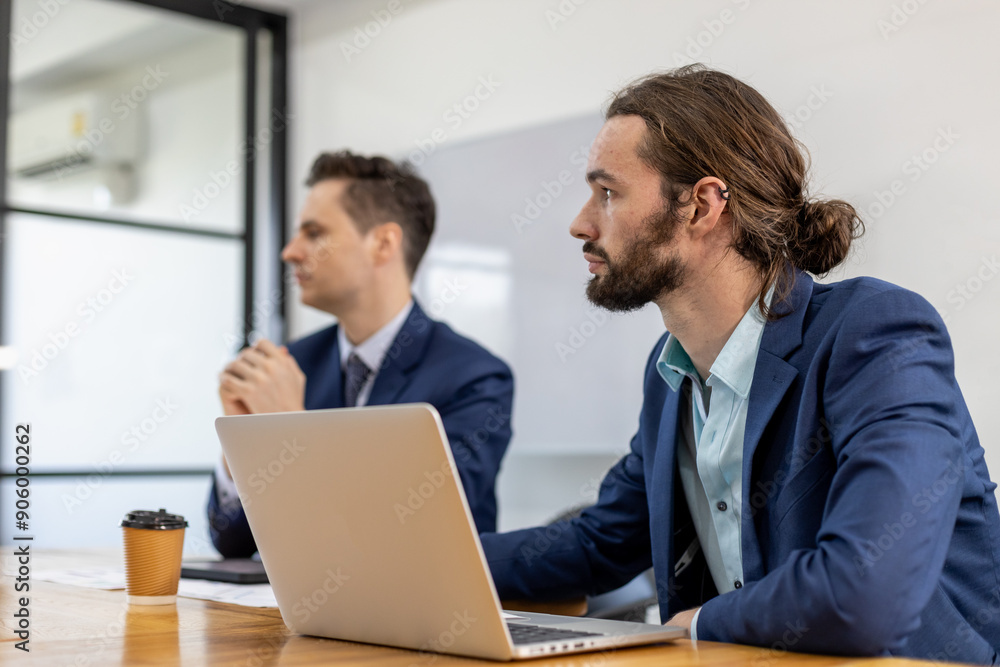 Handsome businessman with mustache beard on face using computer laptop at meeting room. attractive businessperson sitting working in workplace. Handsome businessman with mustache beard on face using computer laptop at meeting room. attractive businessperson sitting working in workplace.