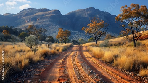 road through the outback with rugged terrain photo