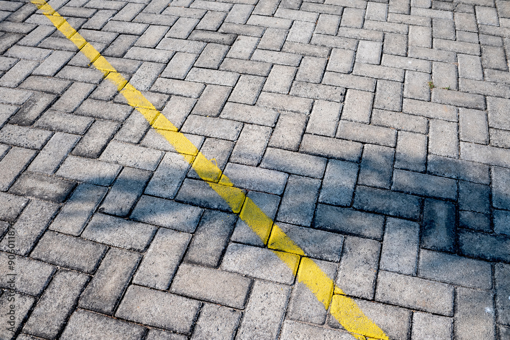 Fototapeta premium paving stone texture with yellow line