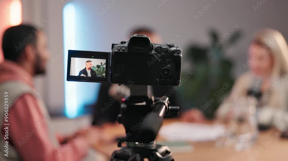 Podcast, camera and screen with host in studio, discussion and advice in streaming show for broadcast. Equipment, tech or record with people for interview, question or content creation for platforms Podcast, camera and screen with host in studio, discussion and advice in streaming show for broadcast. Equipment, tech or record with people for interview, question or content creation for platforms