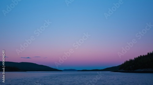 Twilight bathes the sky in a tranquil palette of soft pinks and blues, a fleeting transition.