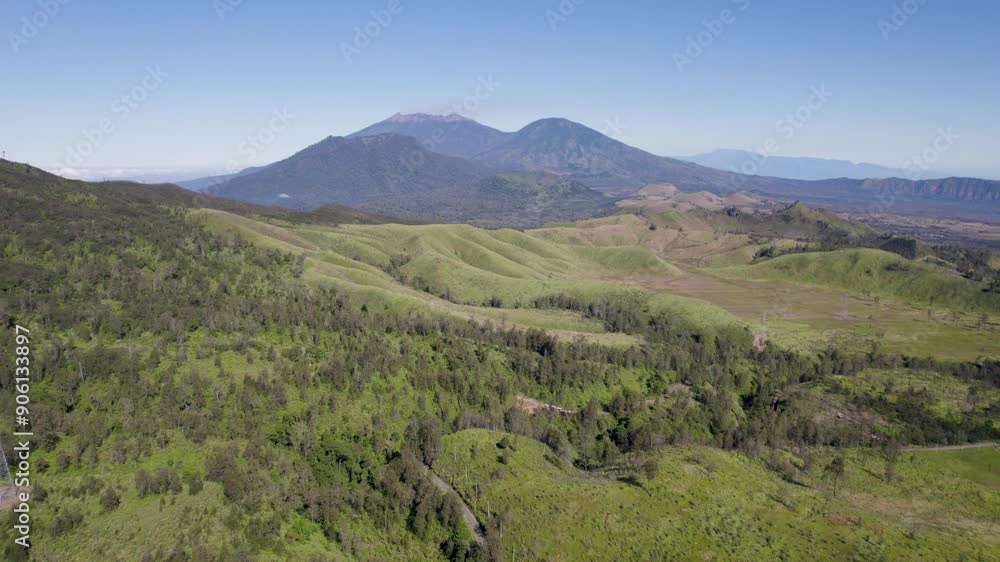 Aerial view of idyllic landscape in nature with mountains in the distance Aerial view of idyllic landscape in nature with mountains in the distance