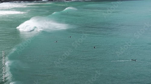 Surfers Riding Waves at New Zealand beach, The Caitlins photo