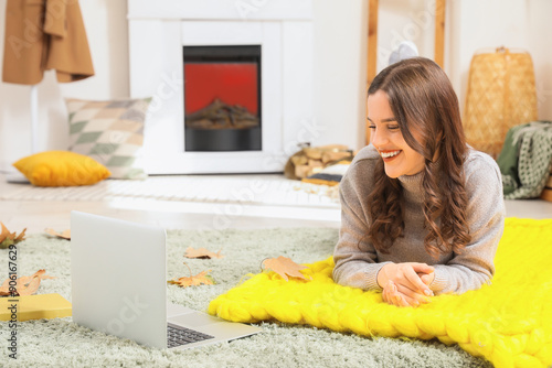 Young woman lying at home o...