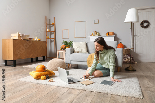 Young woman studying with l...