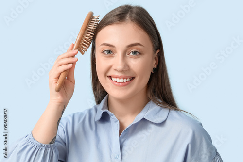 Beautiful woman brushing ha...