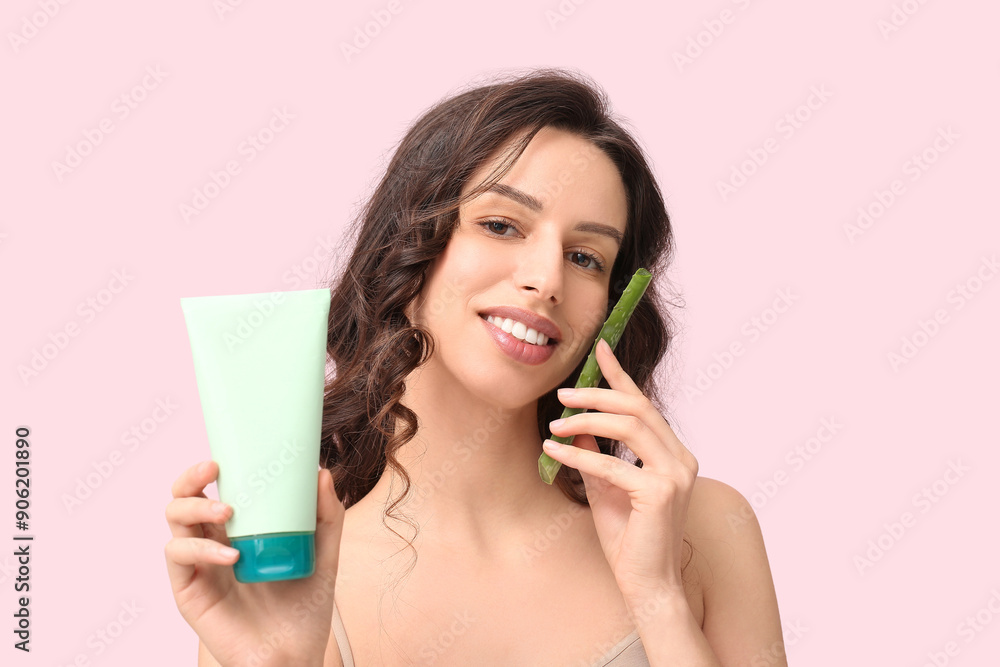 Beautiful young woman with aloe vera and washing gel on color background Beautiful young woman with aloe vera and washing gel on color background