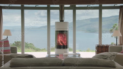 View out of big windows from living room with cozy fireplace overlooking Mull photo