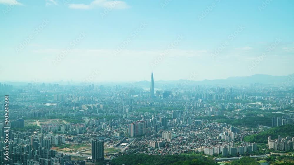 Zooming out From Jamsil District Lotte Worl Tower Revealing Seoul City Skyline on Summer Day. View from Namhansan Mountain Zooming out From Jamsil District Lotte Worl Tower Revealing Seoul City Skyline on Summer Day. View from Namhansan Mountain