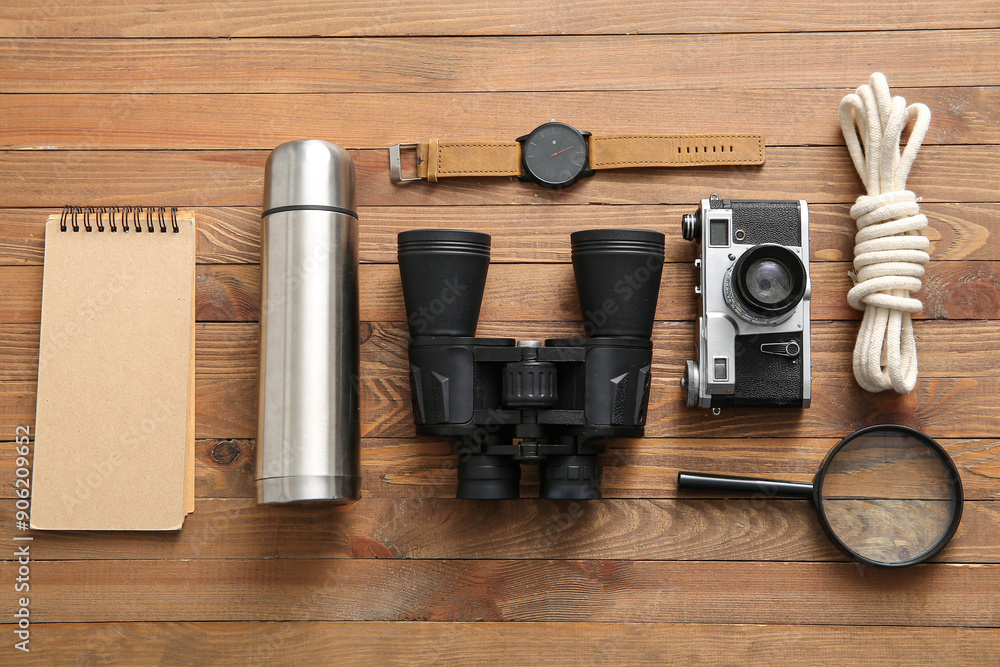Different accessories for travelling on wooden background Different accessories for travelling on wooden background