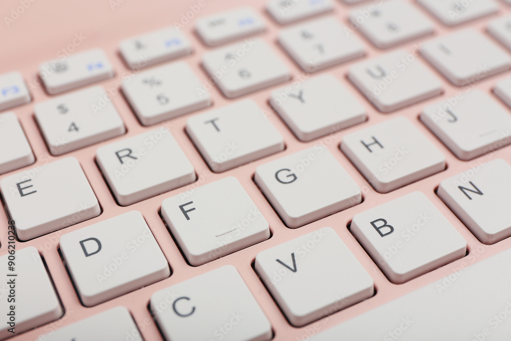 Modern pink computer keyboard, closeup Modern pink computer keyboard, closeup