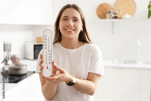 Young woman with home therm...