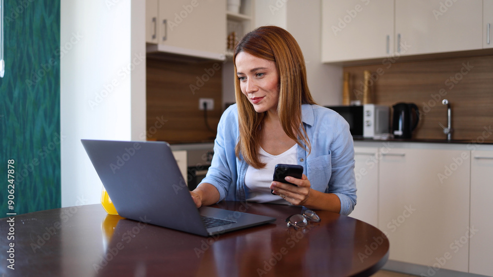 Young woman using smartphone and a laptop and surfing the net at home Young woman using smartphone and a laptop and surfing the net at home