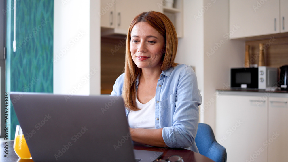 Happy woman having fun online while using laptop Happy woman having fun online while using laptop
