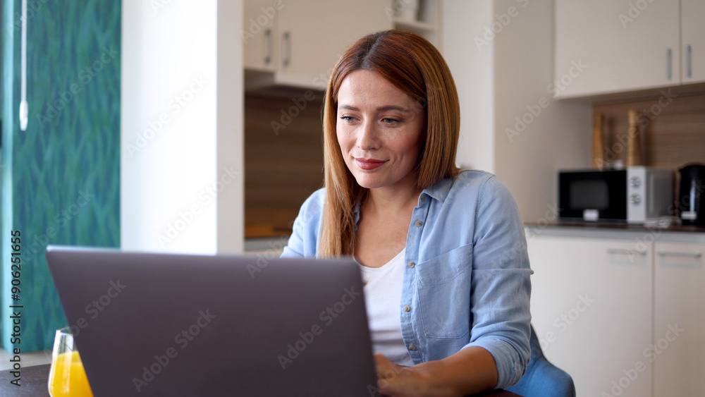 Woman engaging in online work from her home office