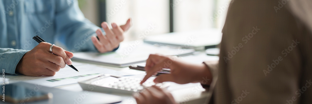 Business administrator calculates profit in a conference room Business administrator calculates profit in a conference room