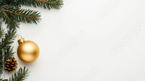 Minimalist white background with a single golden ornament, green pine needles framing the top left corner, ample space for text 