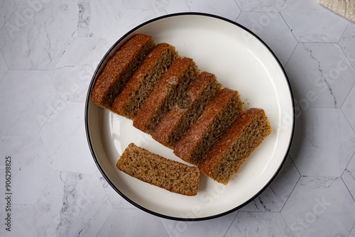 Slices of banana cake in a white plate photo