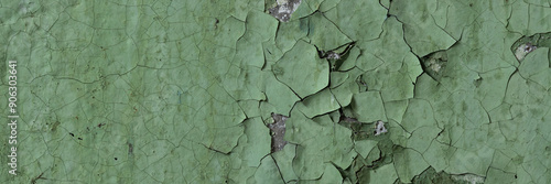 Peeling paint on the wall. Panorama of a concrete wall with old cracked flaking paint. Weathered rough painted surface with patterns of cracks and peeling. Wide panoramic texture for grunge background