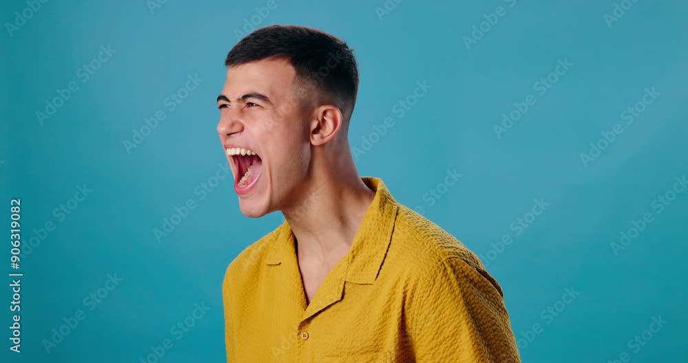 Man, screaming and angry in studio mockup for bad news, tragedy or frustrated. Male person, yell or stress on blue background space for reaction, mental health crisis or burnout in cathartic exercise Man, screaming and angry in studio mockup for bad news, tragedy or frustrated. Male person, yell or stress on blue background space for reaction, mental health crisis or burnout in cathartic exercise