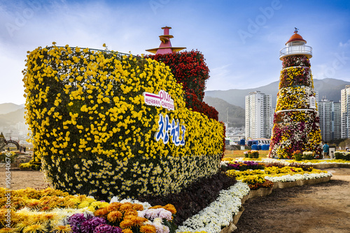 Masanhappo-gu, Changwon-si, Gyeongsangnam-do, South Korea - November 9, 2022: Sculptures of ship and lighthouse with various colorful chrysanthemum on the plaza of Masan Ocean New City
 photo