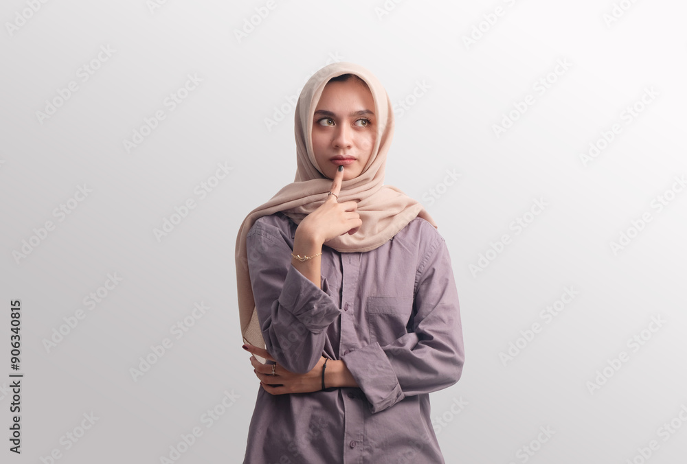 Pretty Asian Muslim woman with think gesture Pretty Asian Muslim woman with think gesture