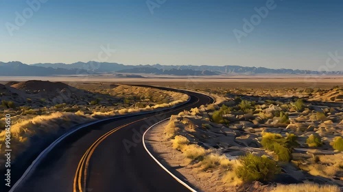 sert road animation. Creating an image of a long, winding road with the vast, open landscape stretching to the horizon. Embark on an endless journey along desert roads in motion. photo