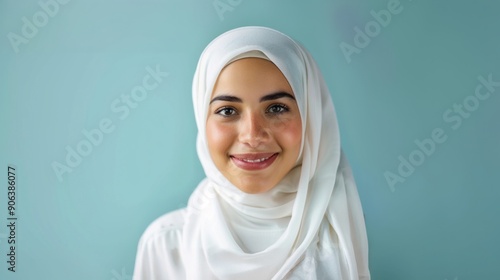 Smiling Young Woman in Hijab with Soft Pink Background.Generated image 