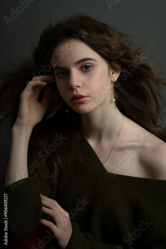 Wallpaper Mural Young beautiful woman with long curly hair and young perfect skin. Model in casual clothes with perfect wavy hair. Low Key Portrait photography. Beautiful teen girl portrait. Torontodigital.ca