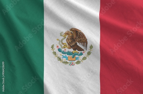 Mexico flag depicted on folded wavy fabric of old cloth close up