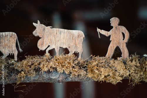 Rustic wooden figures depicting Swiss winter scene photo