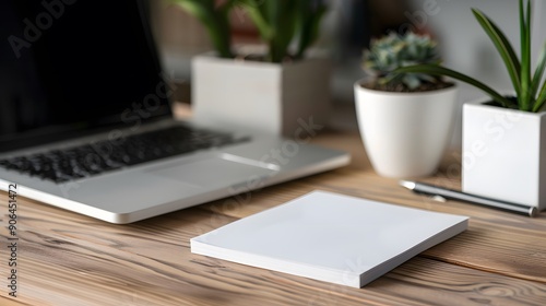 White adhesive note paper on an office desk, ideal for business reminders