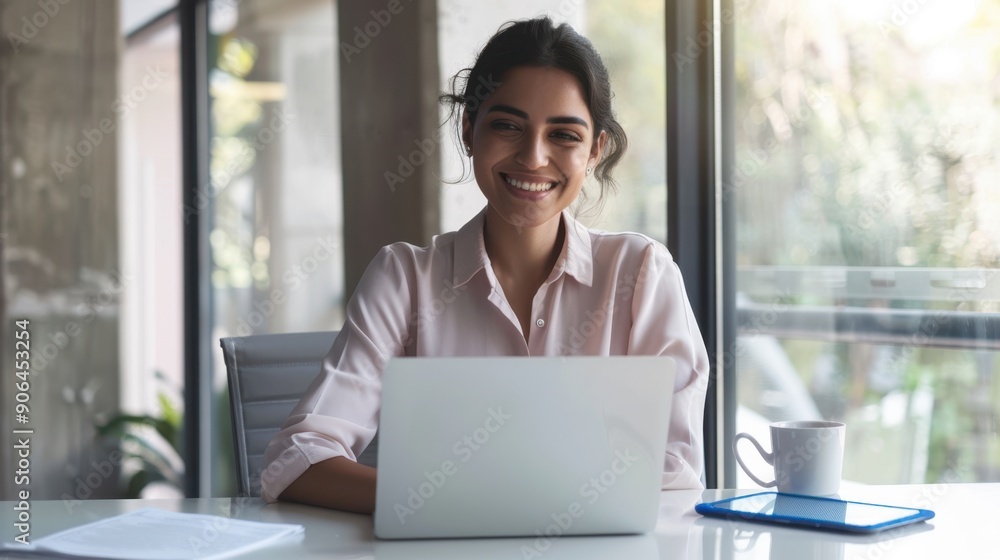 The smiling businesswoman at office
