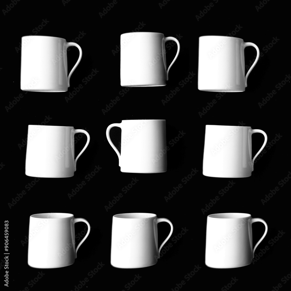 White Porcelain mugs in Quirky not Quite Symmetrical Arrangement on Black Background White Porcelain mugs in Quirky not Quite Symmetrical Arrangement on Black Background