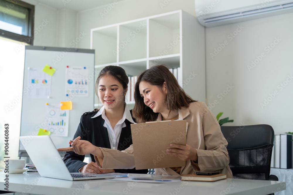 Professional Business Meeting in Modern Office with Two Women Collaboration on a Project Using a Laptop and Documents Professional Business Meeting in Modern Office with Two Women Collaboration on a Project Using a Laptop and Documents