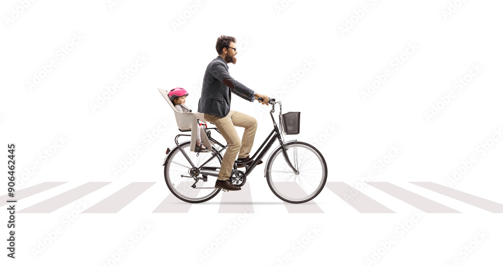 Obraz premium Father riding a child in a bicycle seat at a pedestrian crossing
