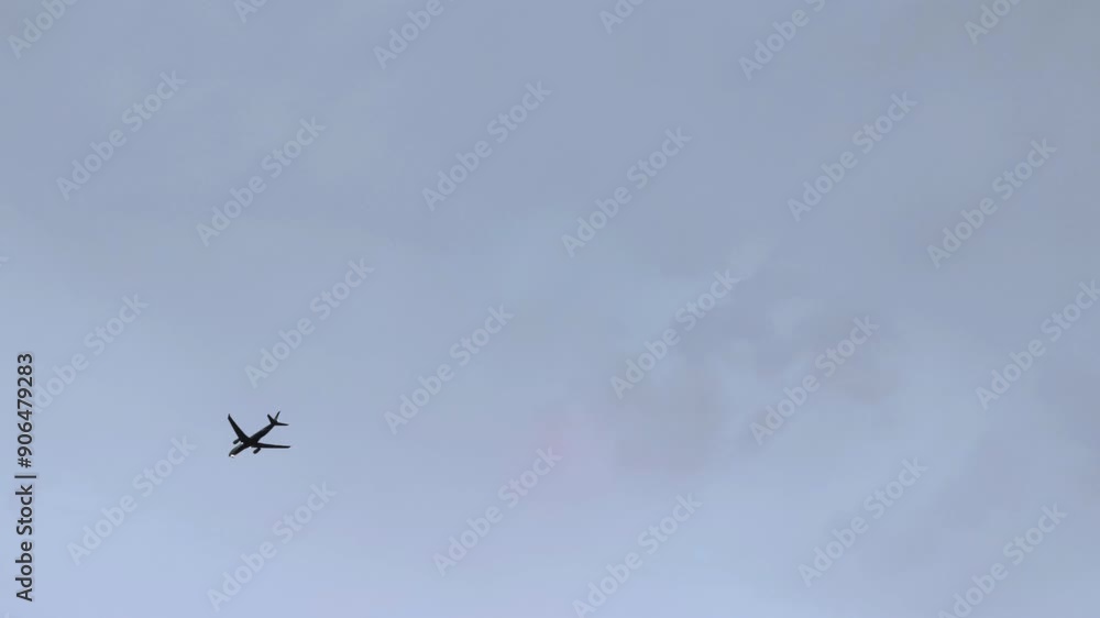 Silhouette of a passenger plane flying before landing on the background of evening sky. Silhouette of a passenger plane flying before landing on the background of evening sky.