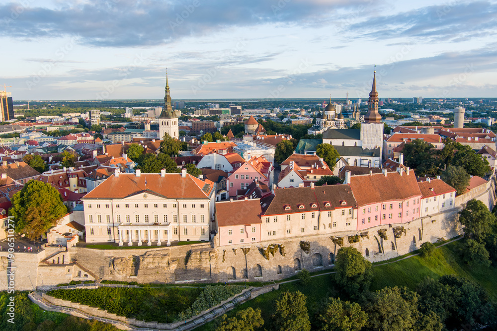 Fototapeta premium Iconic aerial skyline view of Tallinn Old Town and Toompea hill on a sunny summer evening. Stenbock House, Patkuli viewing platform, defensive walls, rooftops.