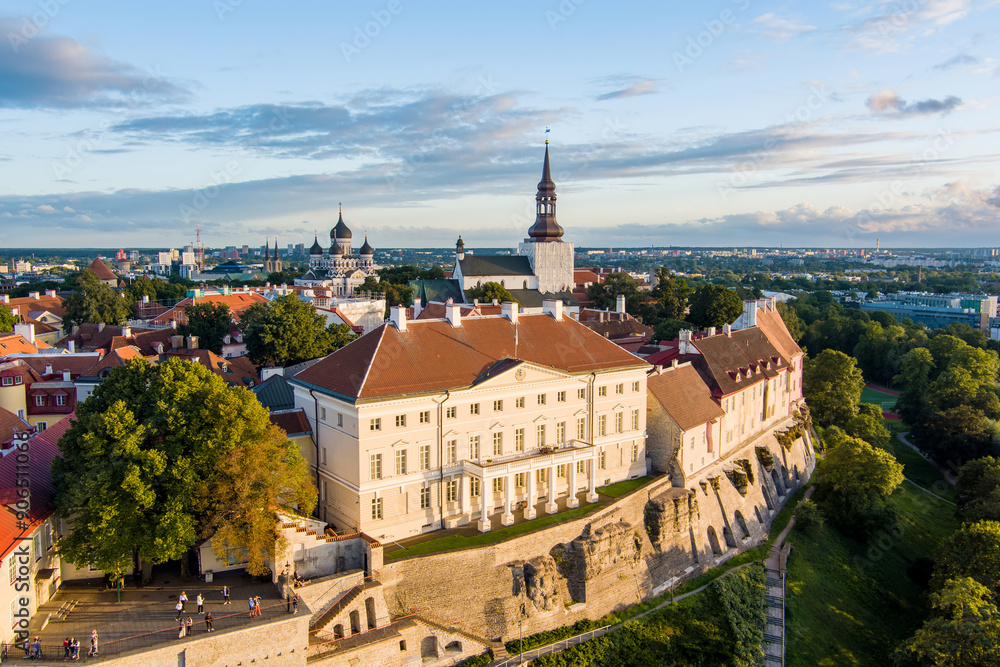 Iconic aerial skyline view of Tallinn Old Town and Toompea hill on a sunny summer evening. Stenbock House, Patkuli viewing platform, defensive walls, rooftops. Iconic aerial skyline view of Tallinn Old Town and Toompea hill on a sunny summer evening. Stenbock House, Patkuli viewing platform, defensive walls, rooftops.