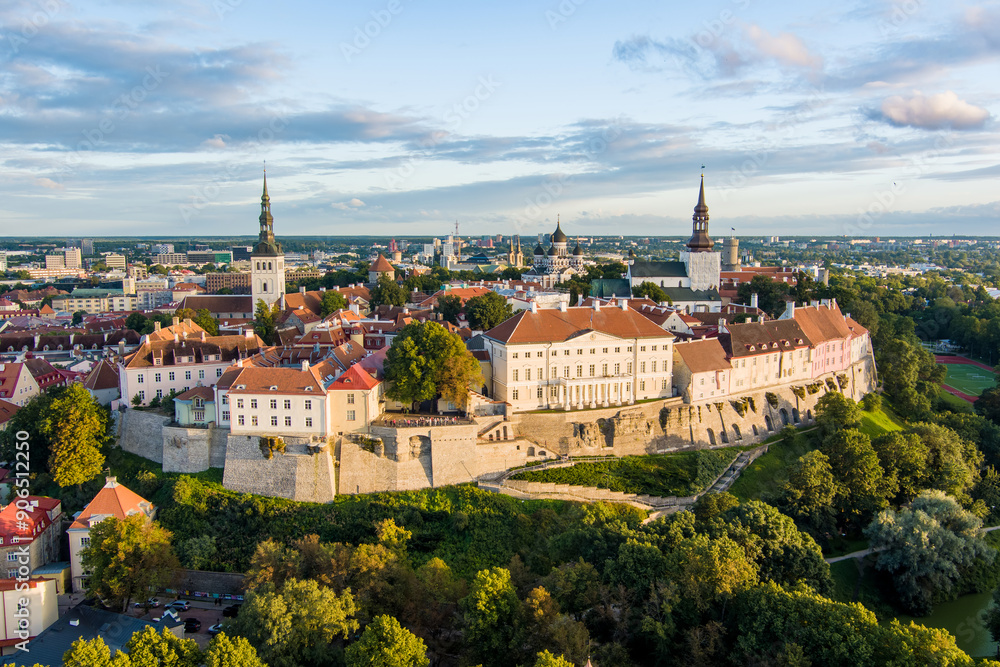 Iconic aerial skyline view of Tallinn Old Town and Toompea hill on a sunny summer evening. Stenbock House, Patkuli viewing platform, defensive walls, rooftops. Iconic aerial skyline view of Tallinn Old Town and Toompea hill on a sunny summer evening. Stenbock House, Patkuli viewing platform, defensive walls, rooftops.