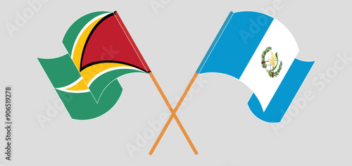 Crossed and waving flags of Guyana and Republic of Guatemala