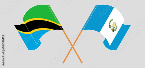 Crossed and waving flags of Tanzania and Republic of Guatemala