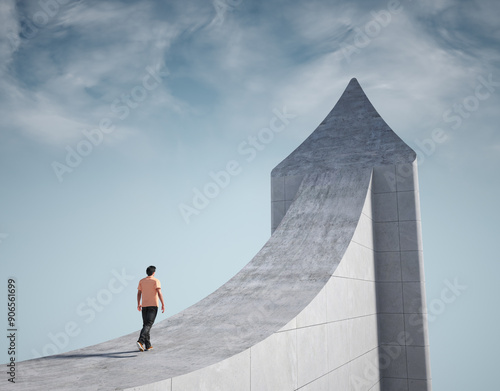 Man climbs a giant arrow pointing to the sky.
