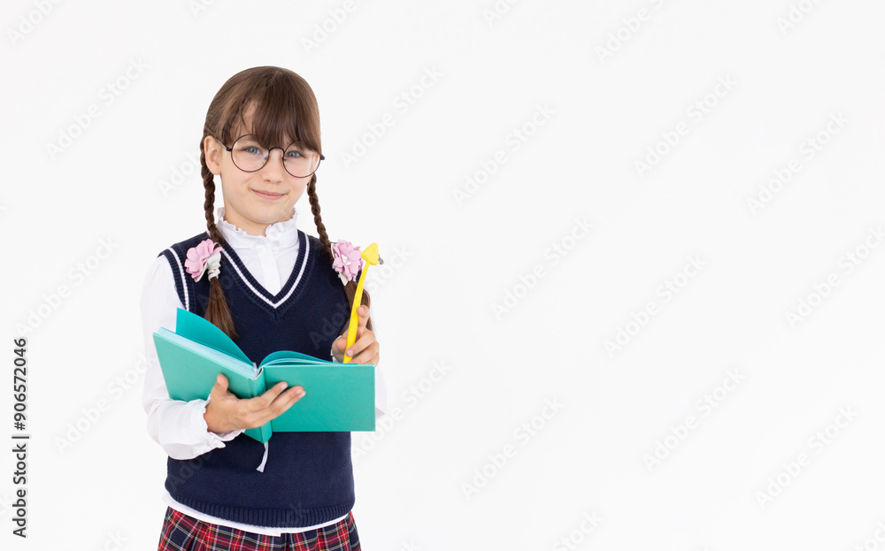 Pupil hold planner. back to school. education. agenda. happy child write in notebook. Portrait of schoolgirl student, studio banner header. School child face, copyspace. Pupil hold planner. back to school. education. agenda. happy child write in notebook. Portrait of schoolgirl student, studio banner header. School child face, copyspace.