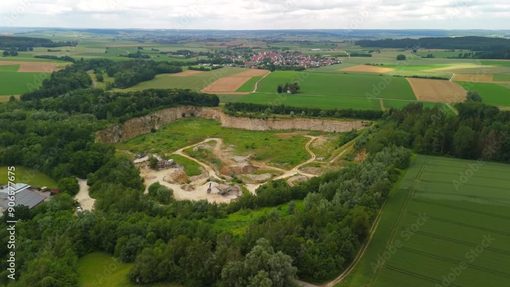 Aerial view of an abandoned mining quarry in Germany im Landkreis Dillingen. Open pit mines drone view. Steinbruch Luftaufnahme in Deutschland, Bayern in der Stadt Haunsheim. Mining equipment. Aerial view of an abandoned mining quarry in Germany im Landkreis Dillingen. Open pit mines drone view. Steinbruch Luftaufnahme in Deutschland, Bayern in der Stadt Haunsheim. Mining equipment.