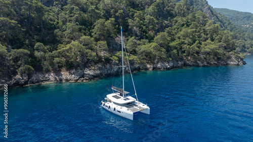 Wallpaper Mural Stunning drone shot of a catamaran navigating the open sea. Torontodigital.ca