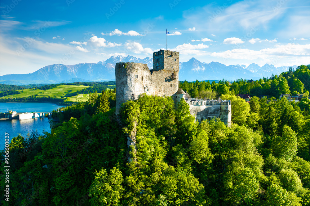 Beautiful view of the castle in Niedzica on a sunny day with the Tatra Mountains in the background, Poland